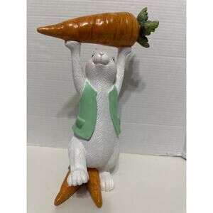 Vintage Easter Bunny in green vest holding up and standing on carrots. brand New